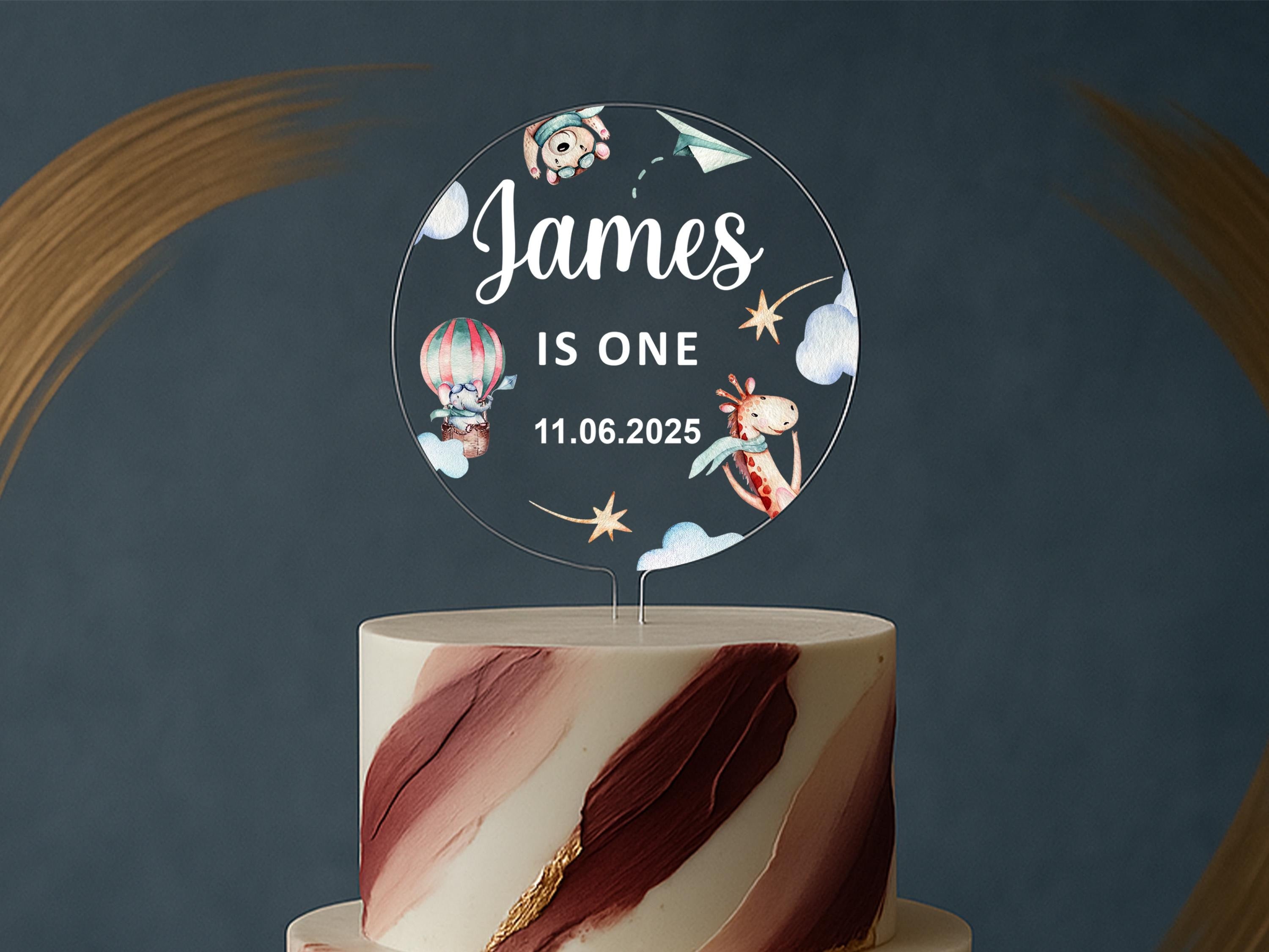 a white and red cake with a name on it
