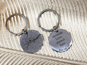 Close-up of personalised keychain with city map design and romantic message