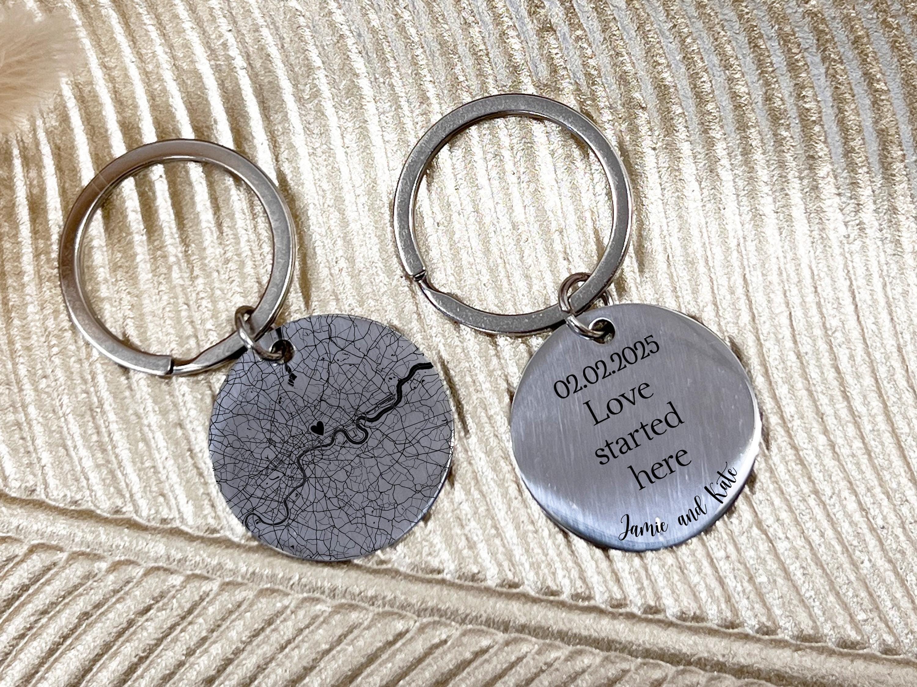 Close-up of personalised keychain with city map design and romantic message