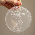 Personalised first Christmas engaged ornament held in hand showing frosted acrylic design with couple proposal illustration, holly leaves, berries and hearts, engraved with names David and Emma 2025