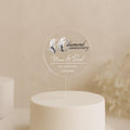 a wedding cake with a white frosted cake topper