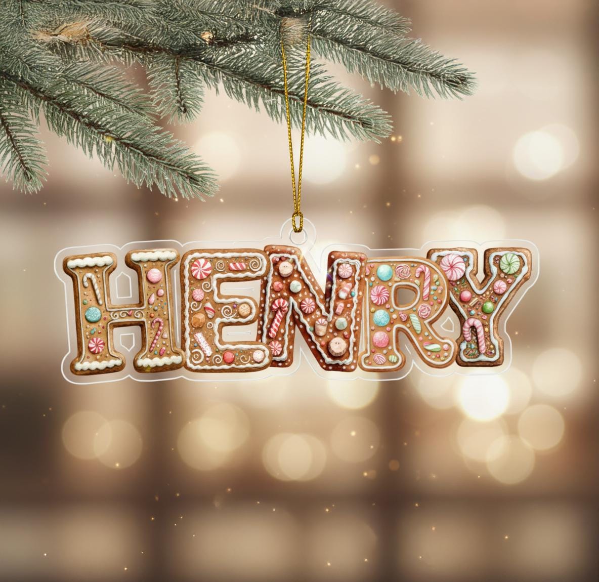 A decorative ornament made to resemble the name "HENRY" in the shape of a gingerbread man, hanging from a branch of a pine tree.