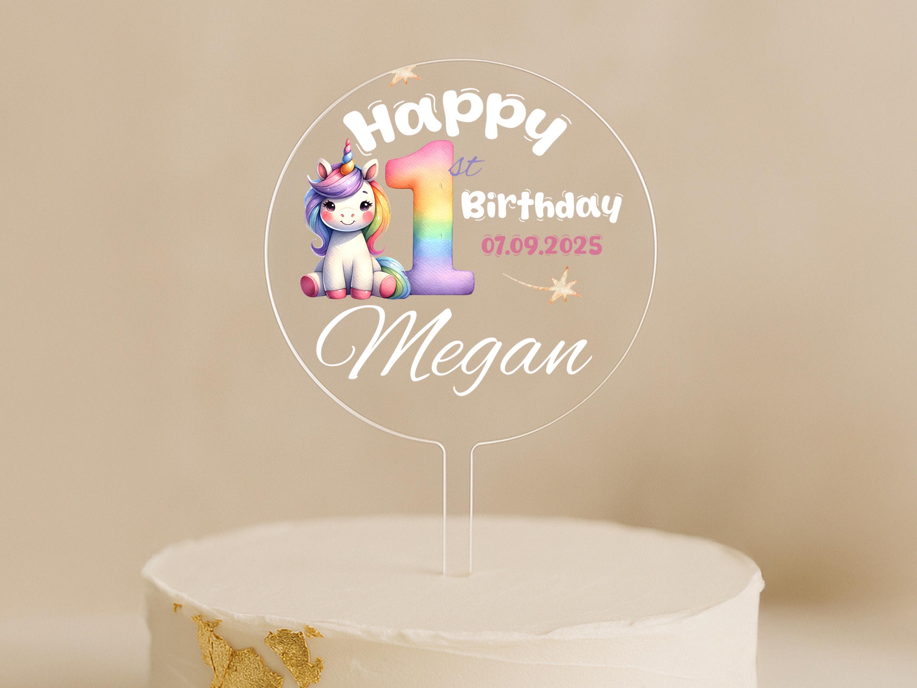 a birthday cake with a unicorn topper on it