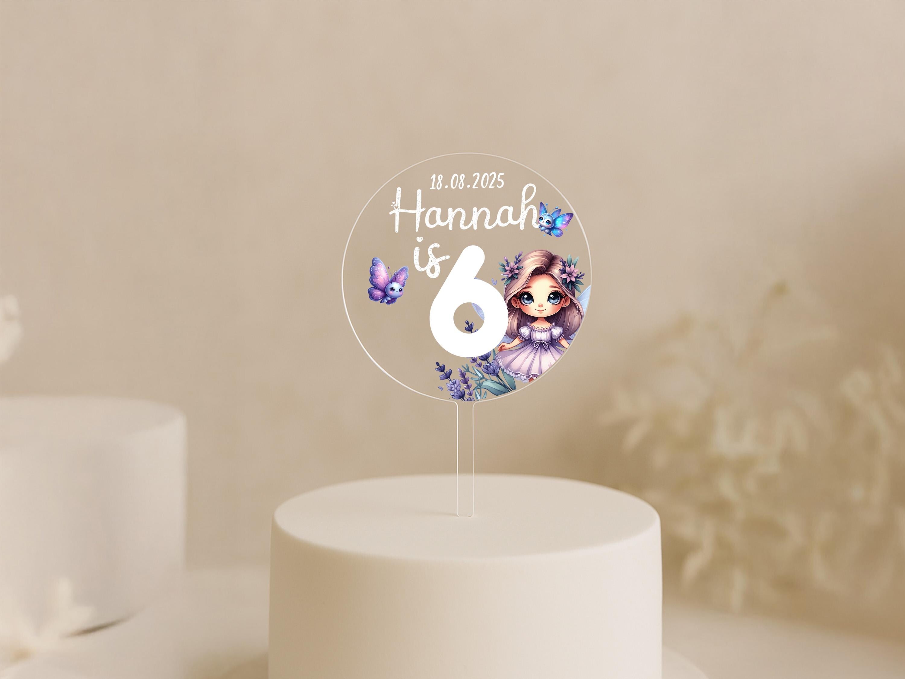 a white cake with a white frosting number six on top of it