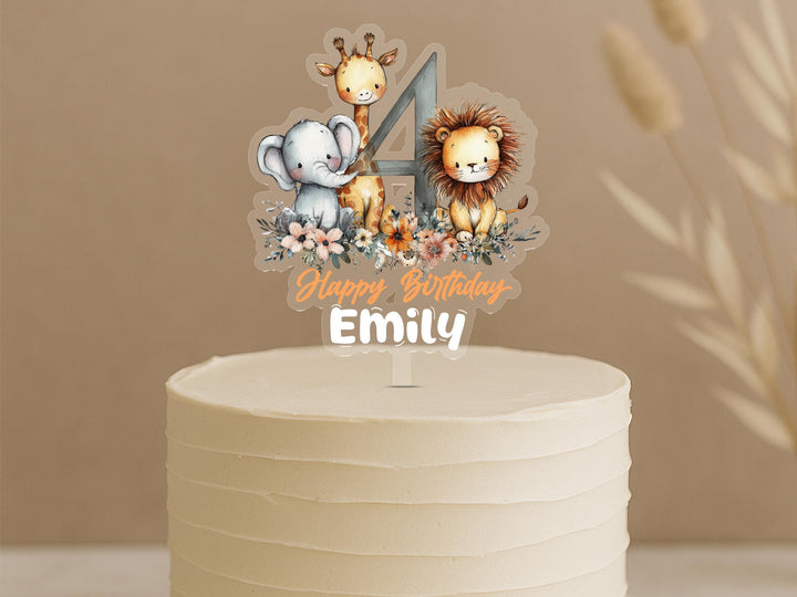 Custom jungle animals cake topper featuring number 4 with cute safari animals and personalised name Emily on cream buttercream cake
