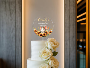 a white cake with a teddy bear on top of it