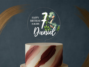 a birthday cake with a dinosaur on top of it