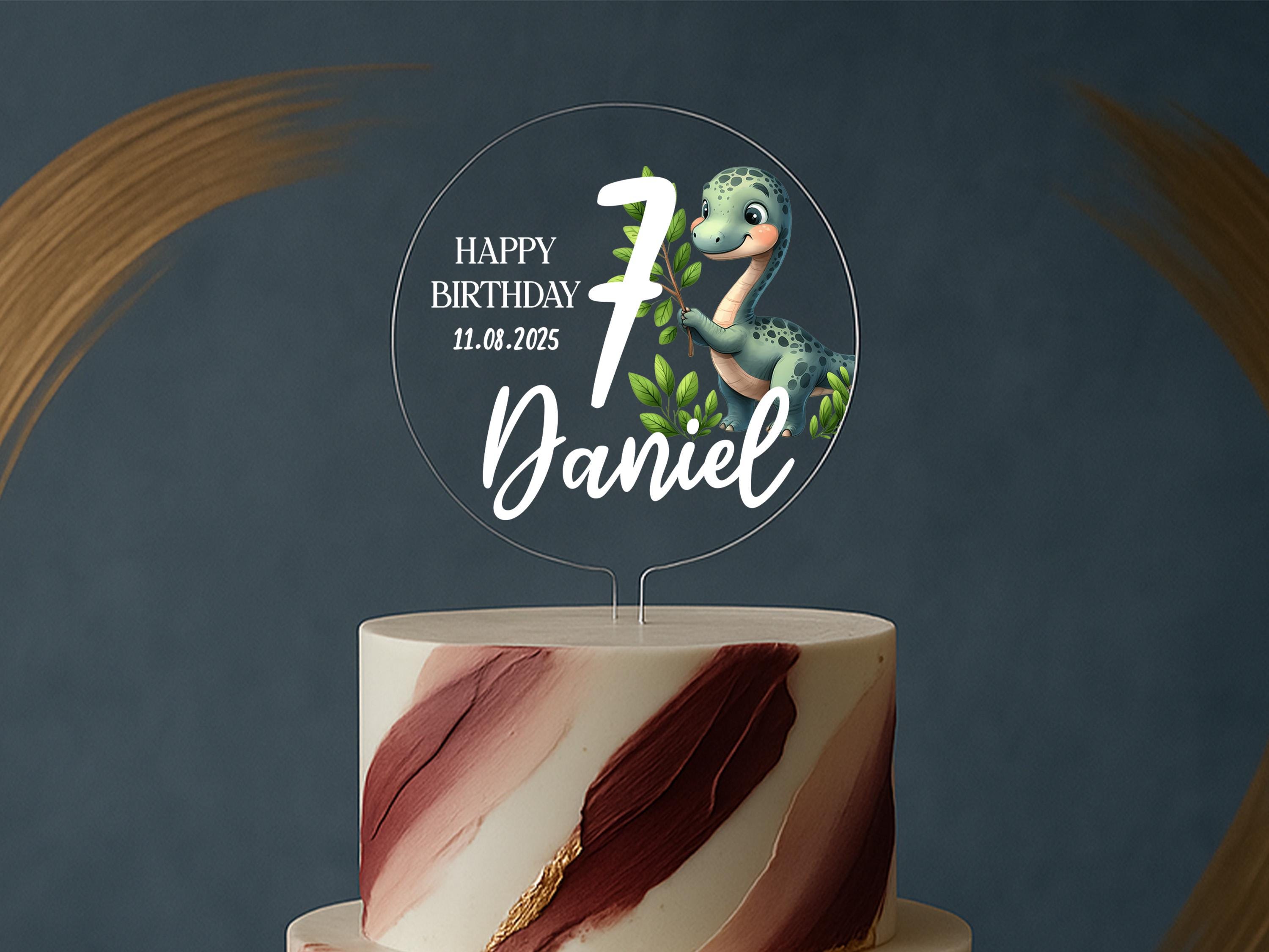 a birthday cake with a dinosaur on top of it