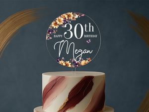 a white and red cake with a sign on top of it