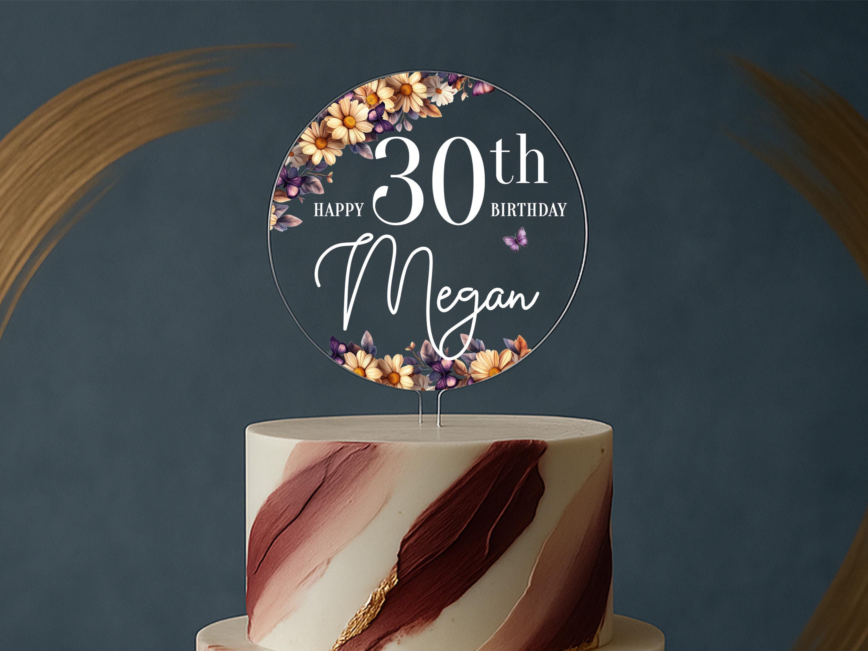 a white and red cake with a sign on top of it
