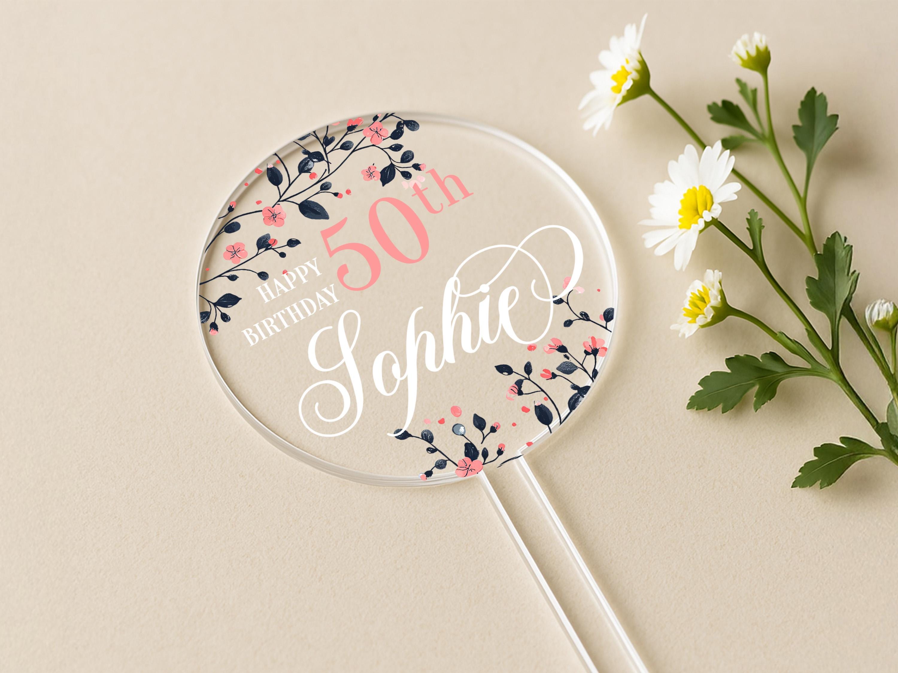 a birthday card with a floral design and a personalized lollipop