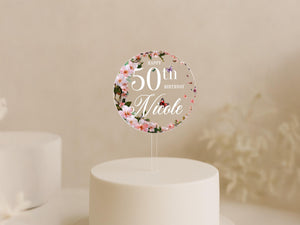 a white cake with a white frosted cake topper