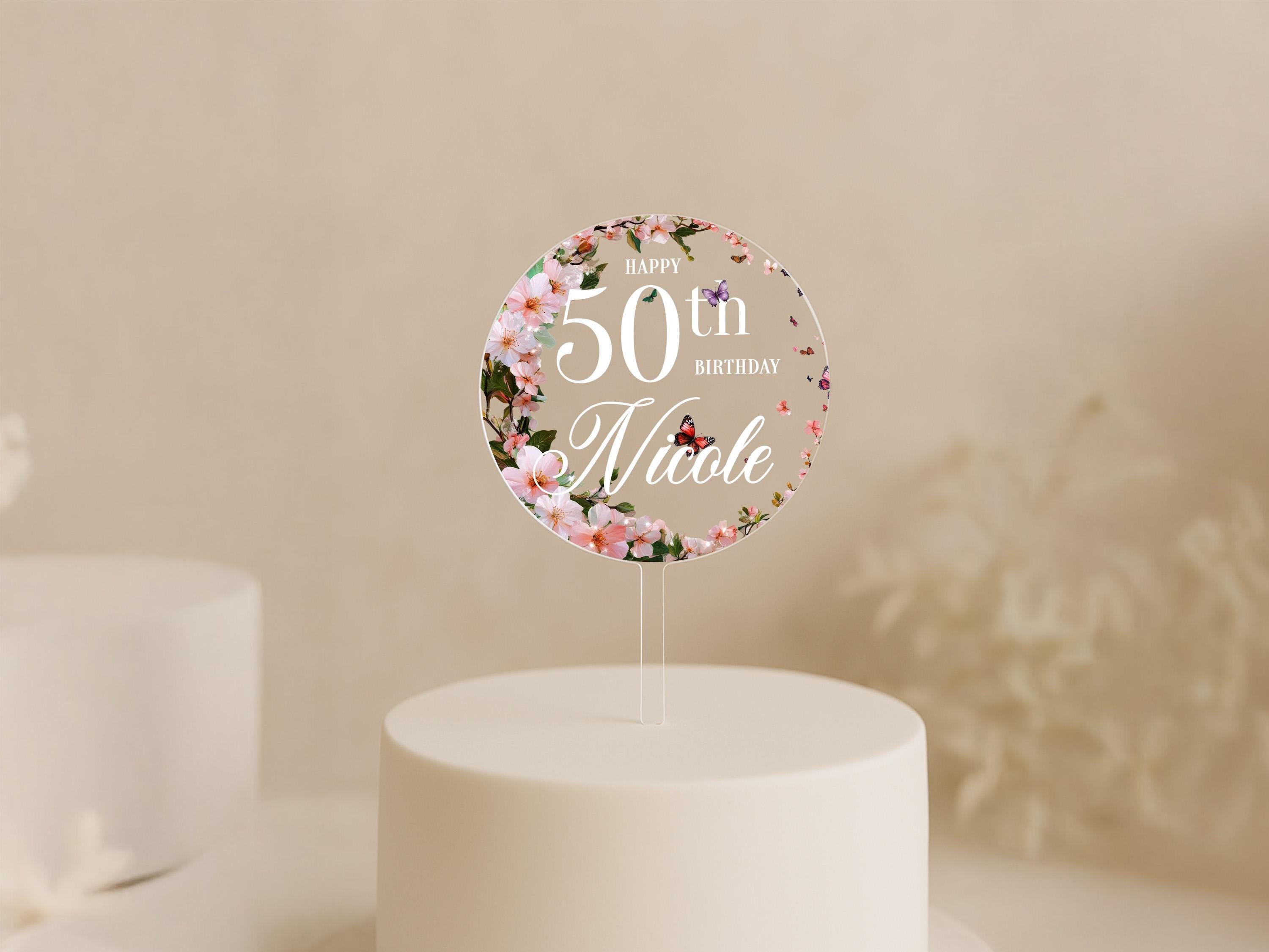 a white cake with a white frosted cake topper