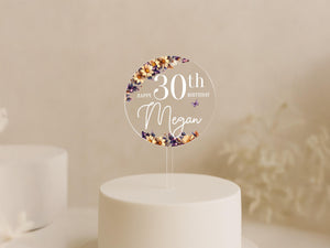 a white cake with a cake topper on it