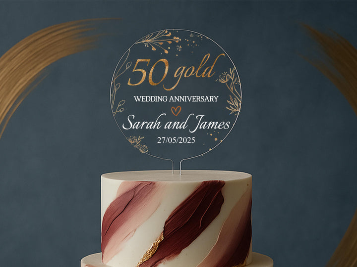 a white and red wedding cake with a sign on top