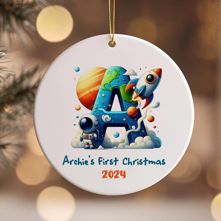 a personalized ornament hanging from a christmas tree