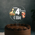 a birthday cake with a dinosaur cake topper