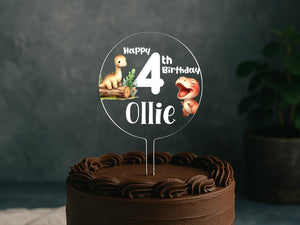 a birthday cake with a dinosaur cake topper