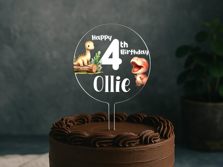 a birthday cake with a dinosaur cake topper