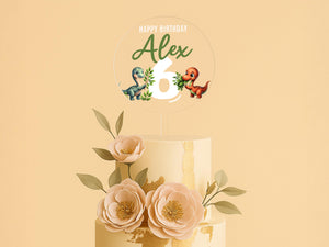 a three tiered cake with flowers on top of it