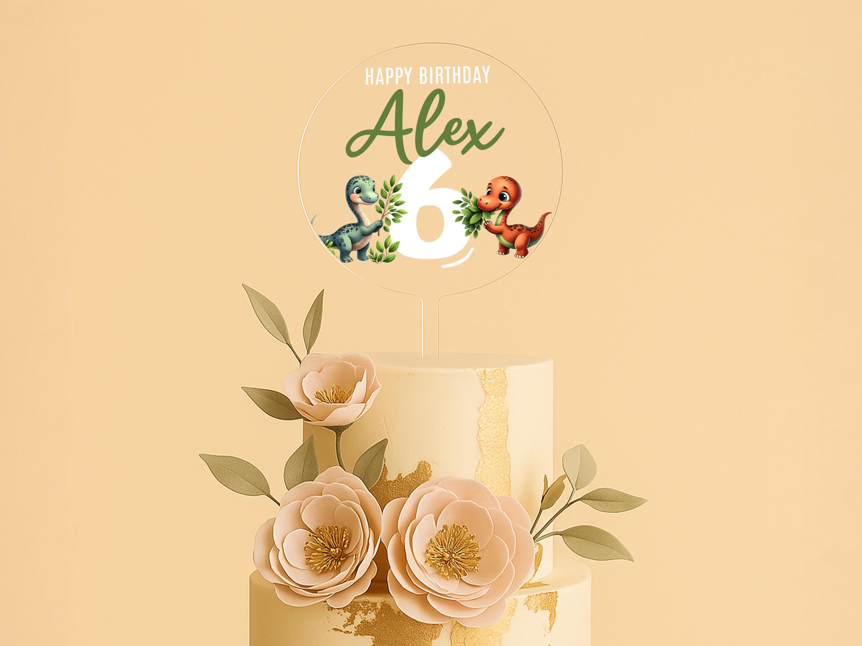 a three tiered cake with flowers on top of it