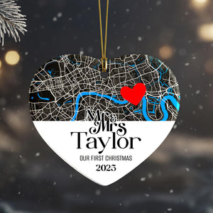 A heart-shaped ornament with a map of London and a red heart symbol, along with the text "Mrs Taylor" and "Our first Christmas" printed on it.