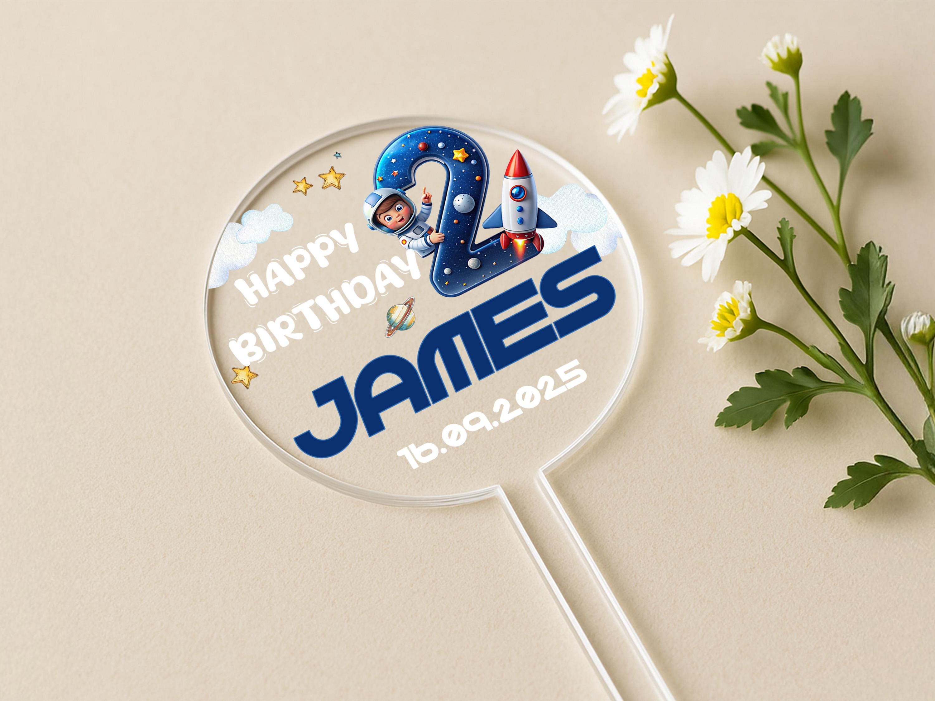 a personalized birthday lollipop next to a flower