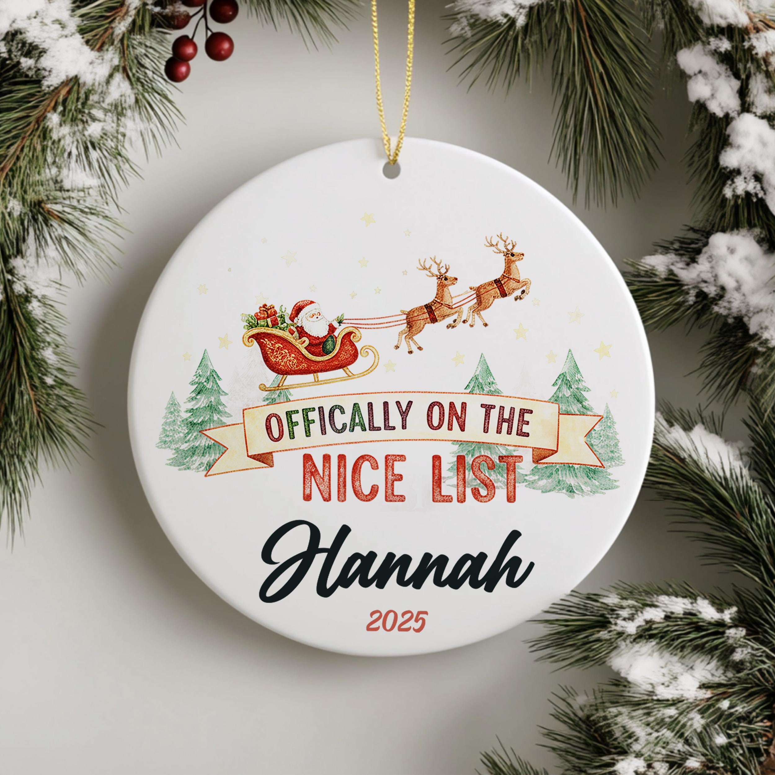 A white ornament with a Santa Claus sleigh and reindeer, along with the text " Officially on the NICE LIST Hannah 2020".