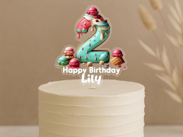 Personalised ice cream birthday cake topper showing number 2 with colorful ice cream scoops, waffle cones and custom name Lily on white cake