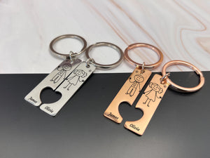 Engraved couple keychains, stick figure illustration, custom names, ideal for anniversaries, weddings, or engagements