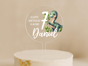 a birthday cake with a dinosaur cake topper