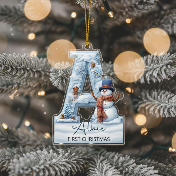 Blue festive letter ornament with snowman and baby name printed on clear acrylic.