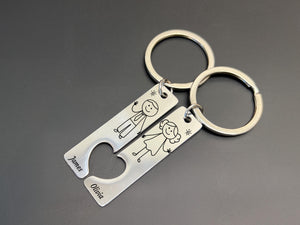 Personalised stick figure couple keyring set, custom engraved names James and Olivia, matching heart cutout, cute couples gift.