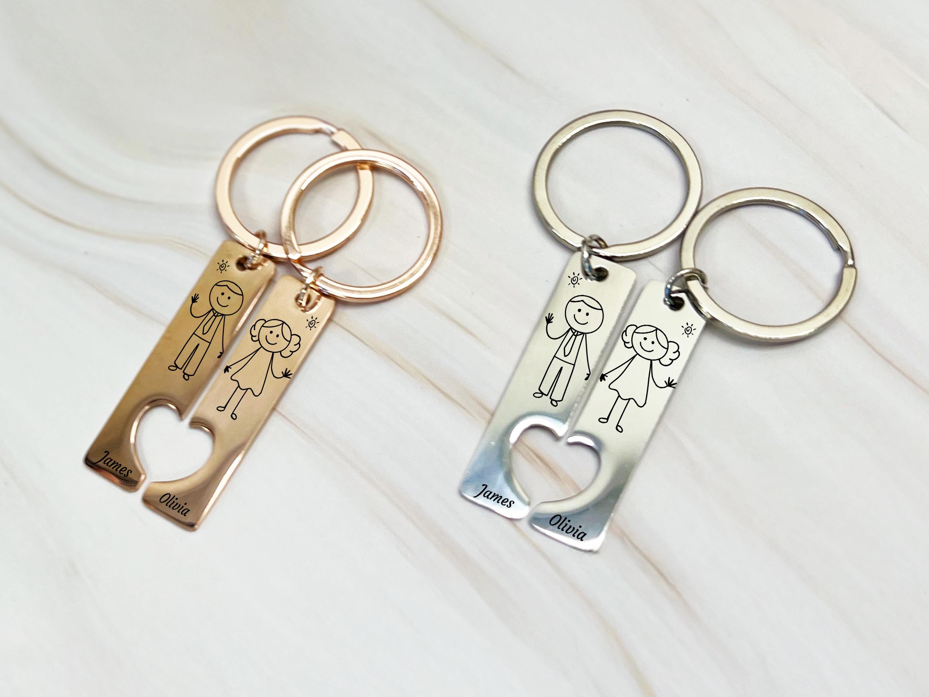 Cute stick figure keyring set, engraved names James and Olivia, connecting heart cutout, custom gift for couples