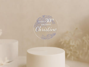 a white cake with a white frosted cake topper