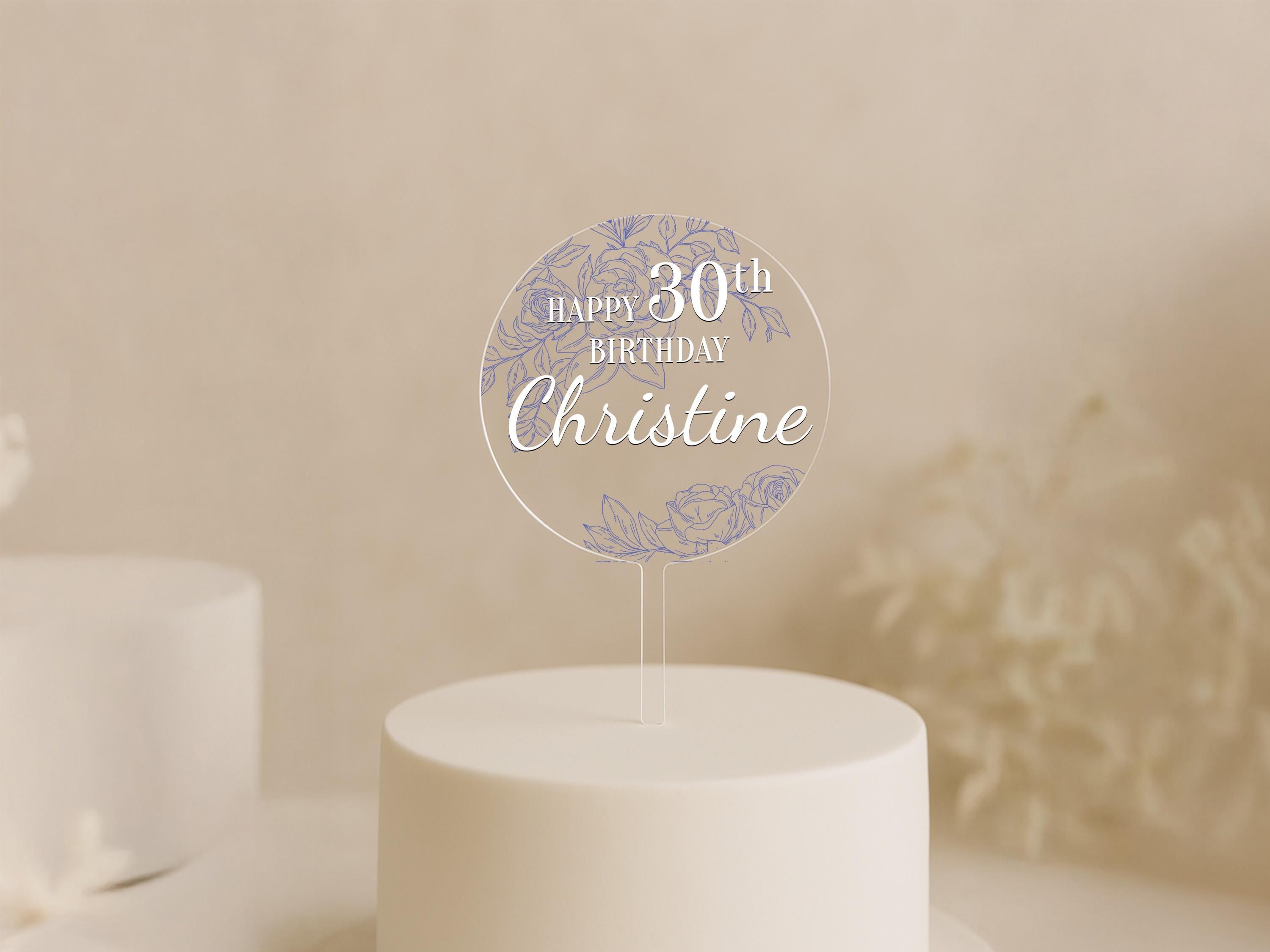 a white cake with a white frosted cake topper