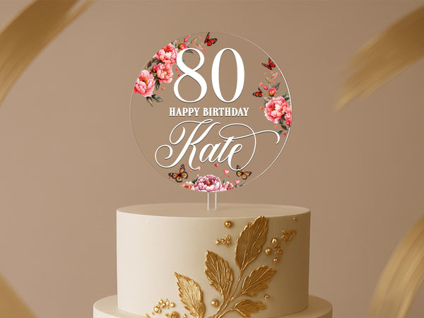 Round 80th birthday cake topper with pink florals, butterflies, and custom name