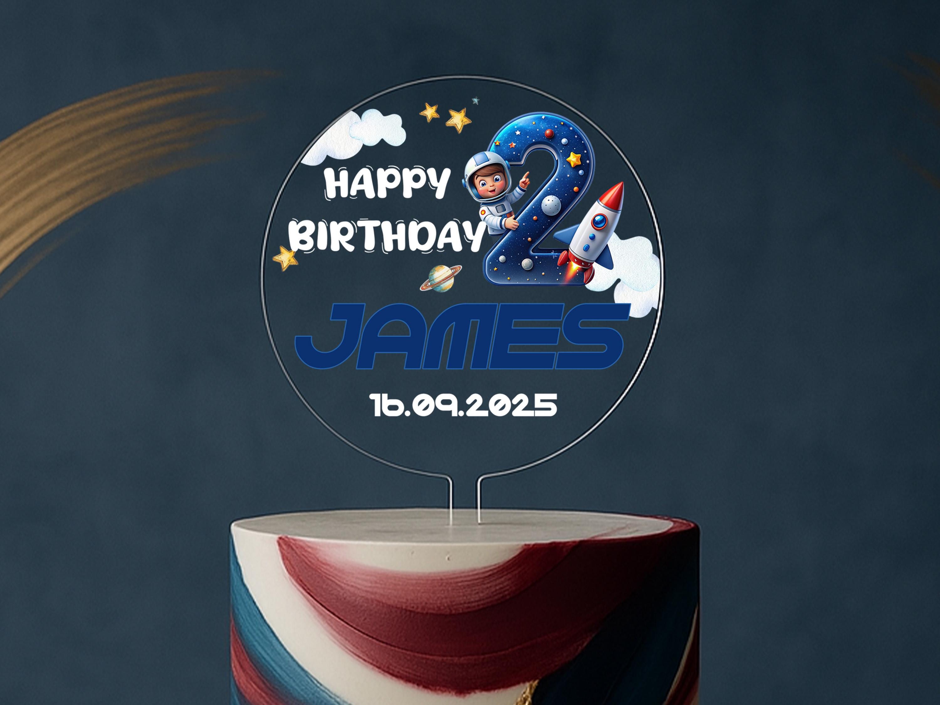 a birthday cake with a photo of an astronaut on it