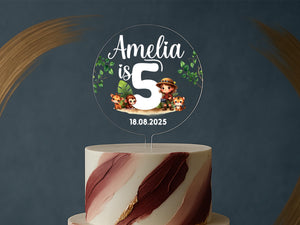 a three tiered cake with a topper on it