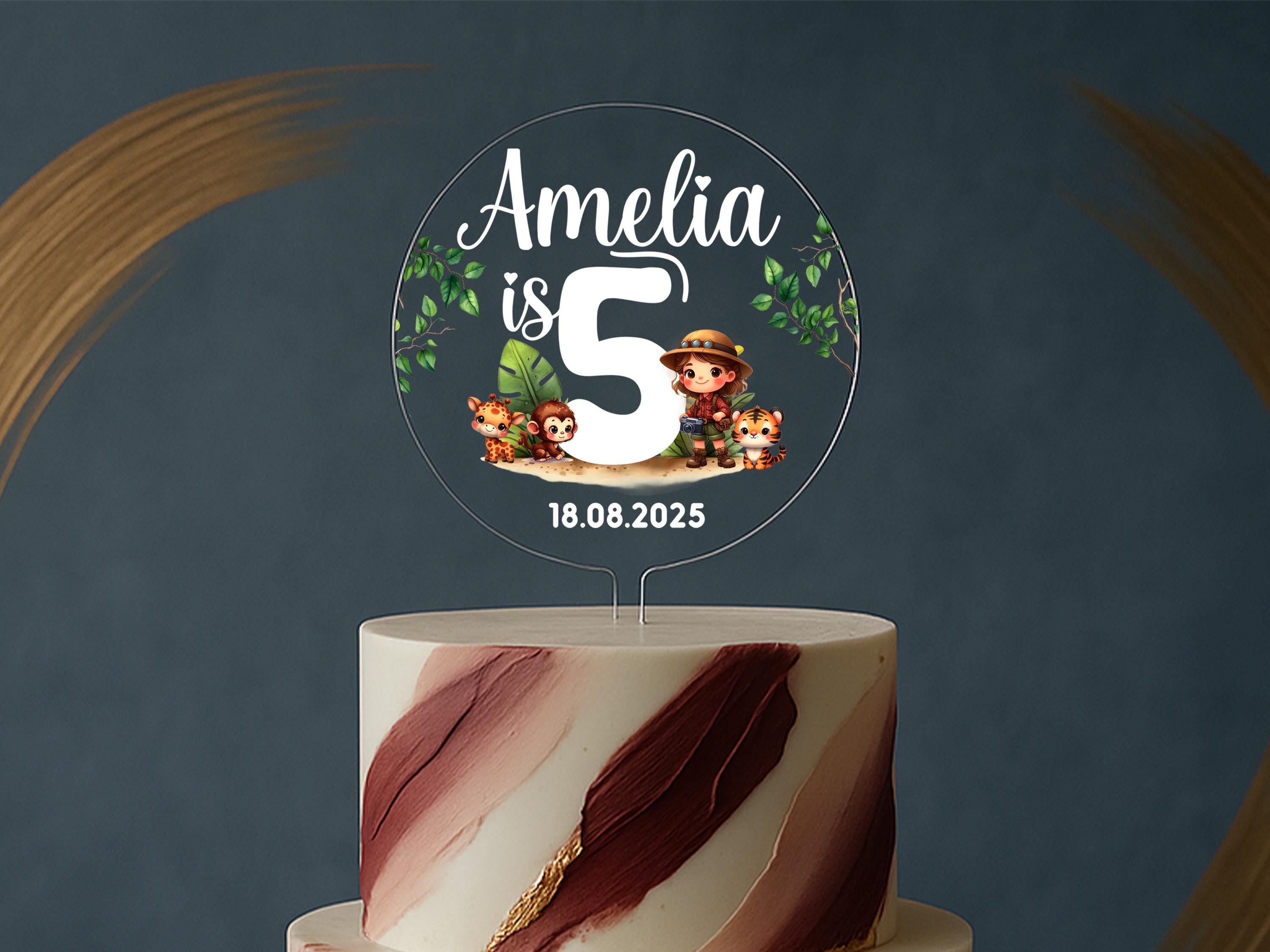 a three tiered cake with a topper on it
