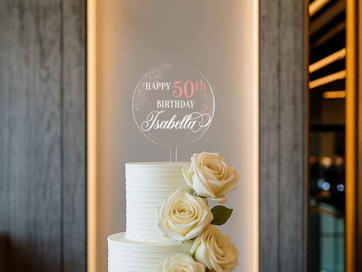 a white cake with roses on top of it