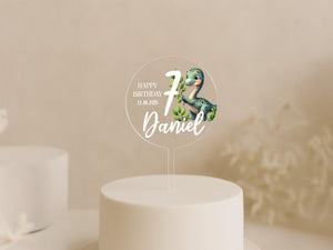 a birthday cake with a name and a picture of a dinosaur