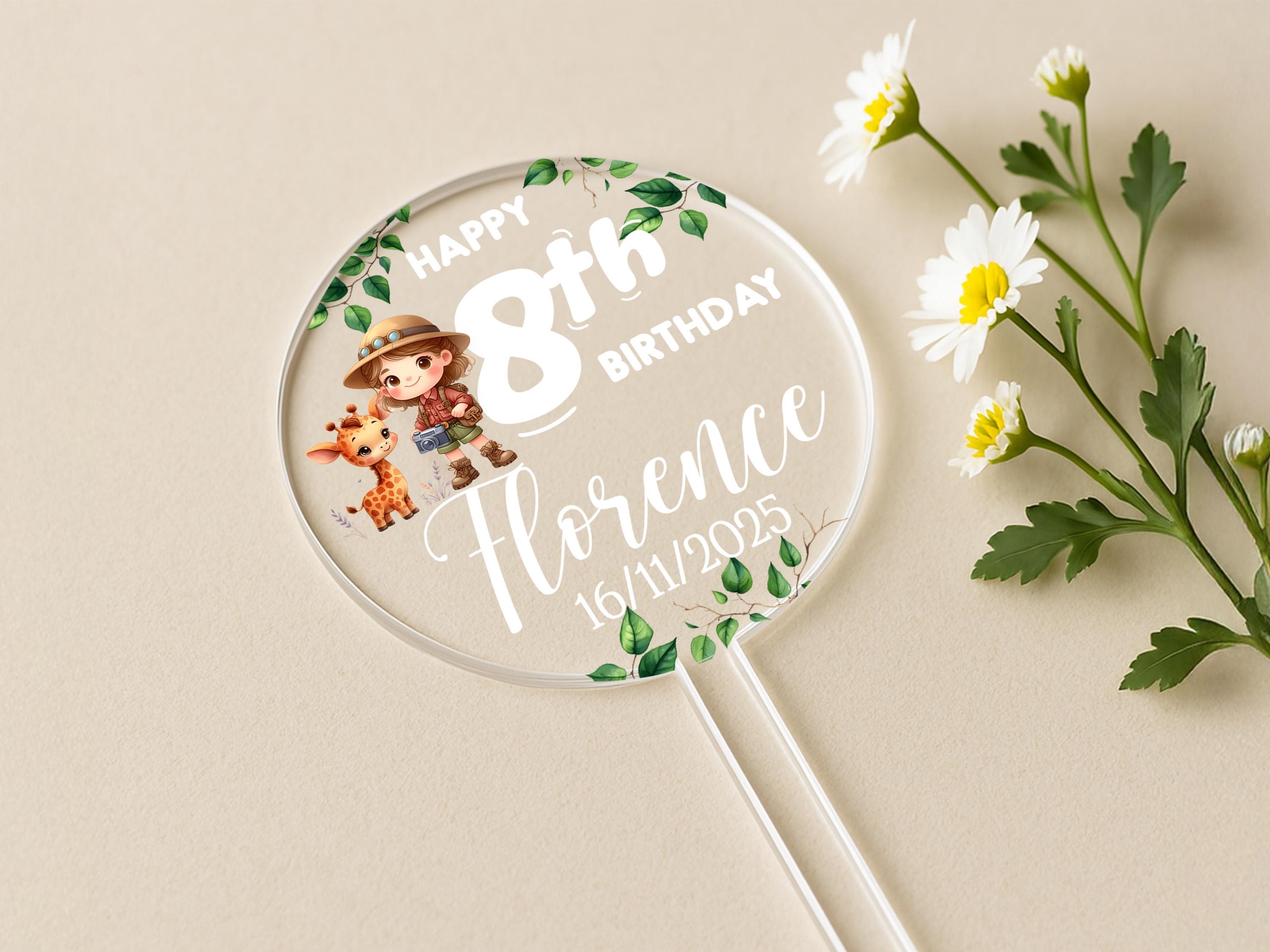 Close-up of personalised name and age safari cake topper