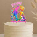 Personalised rainbow swirl unicorn cake topper showing vibrant number 6 with magical swirl patterns, cute unicorn and custom name Zoey on white cake