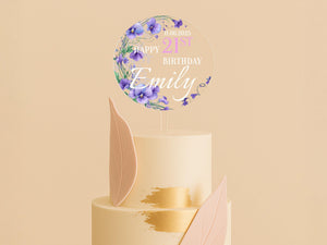 a three tiered cake with a happy birthday sign on top