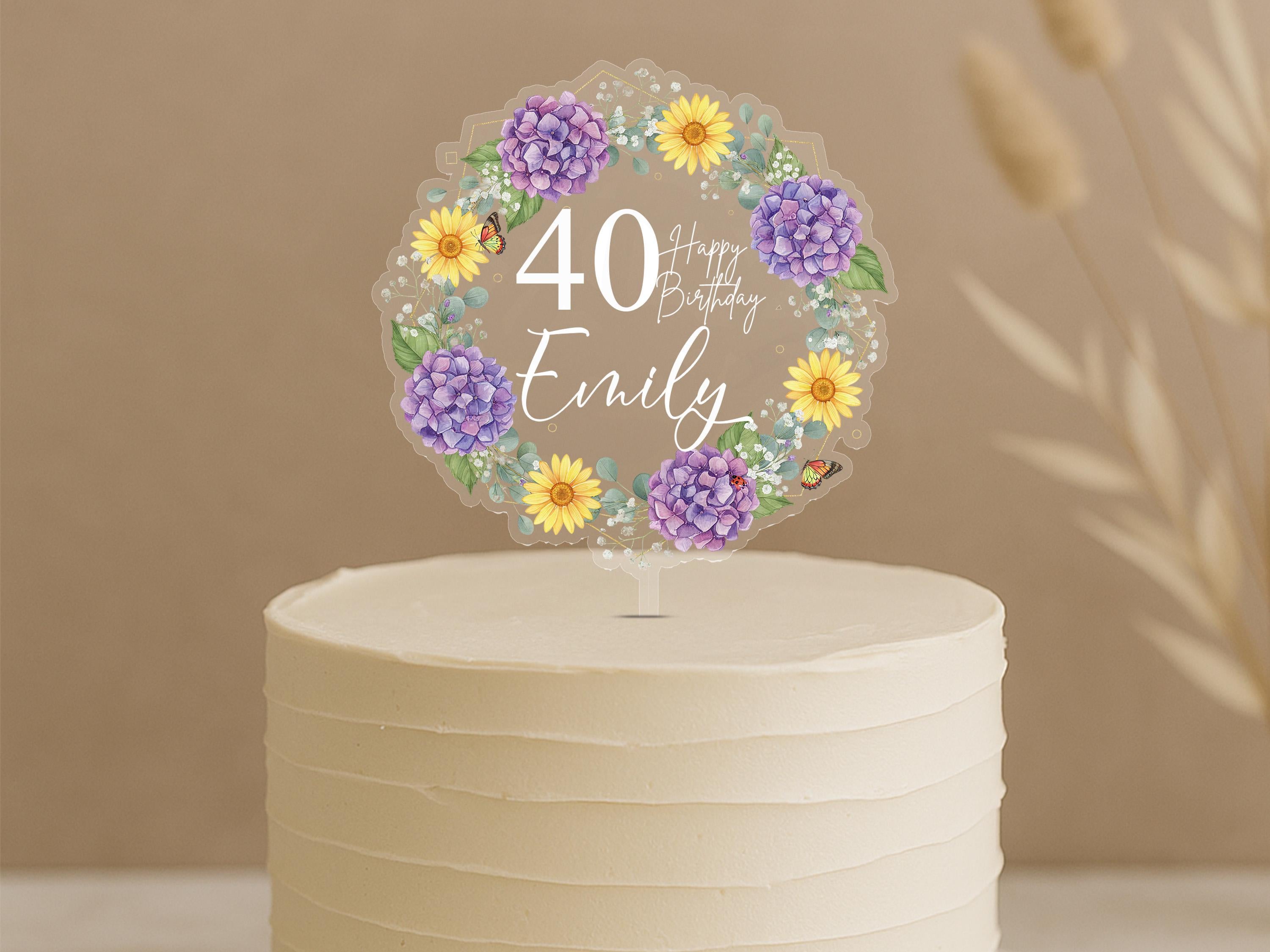 Personalised 40th birthday cake topper featuring elegant circular floral wreath with purple hydrangeas, yellow daisies, butterflies and custom name Emily on white celebration cake