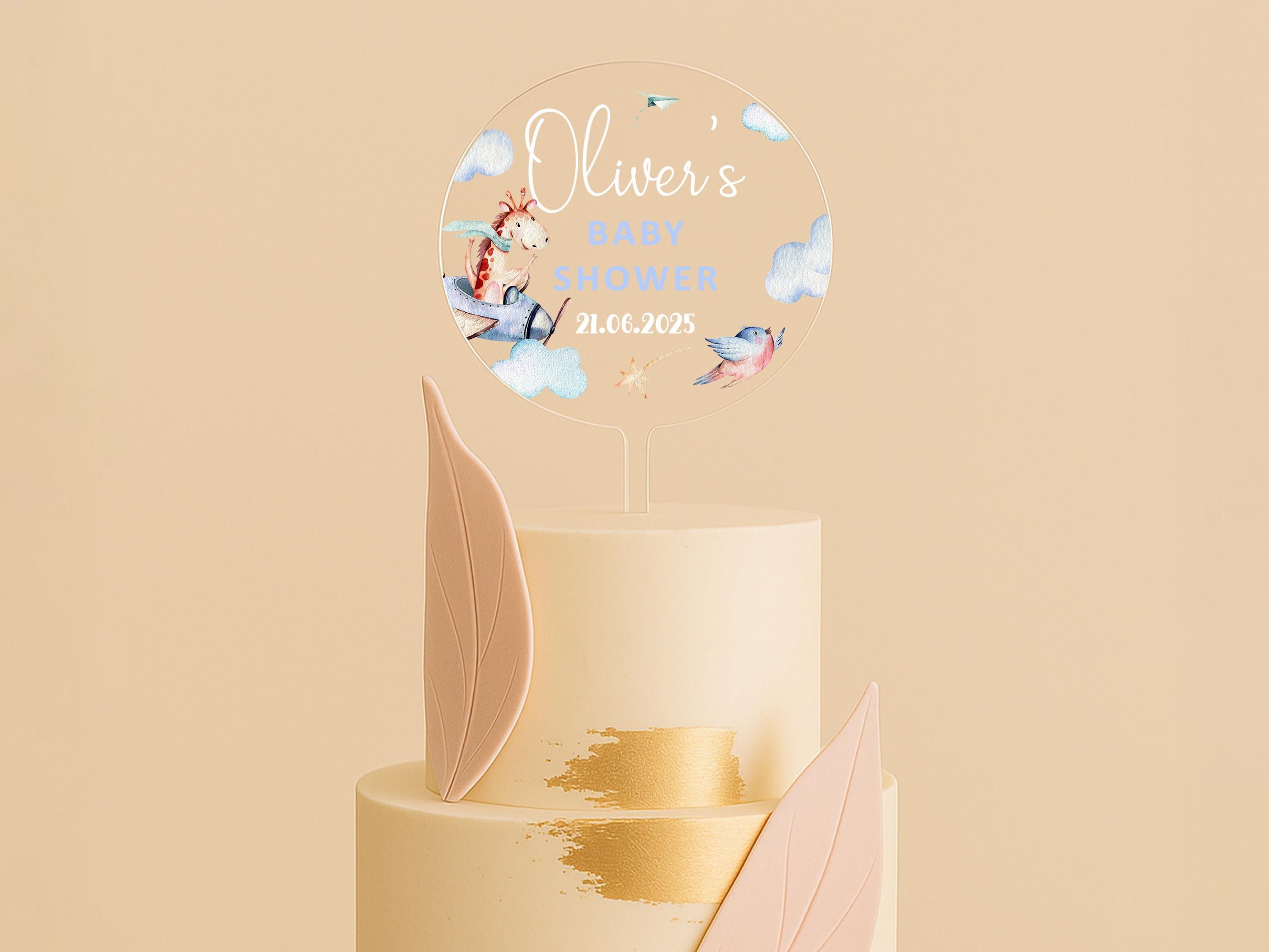 a three tiered cake with a name on top