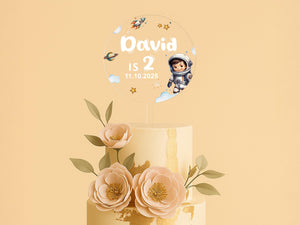 a three tiered cake with flowers on top of it