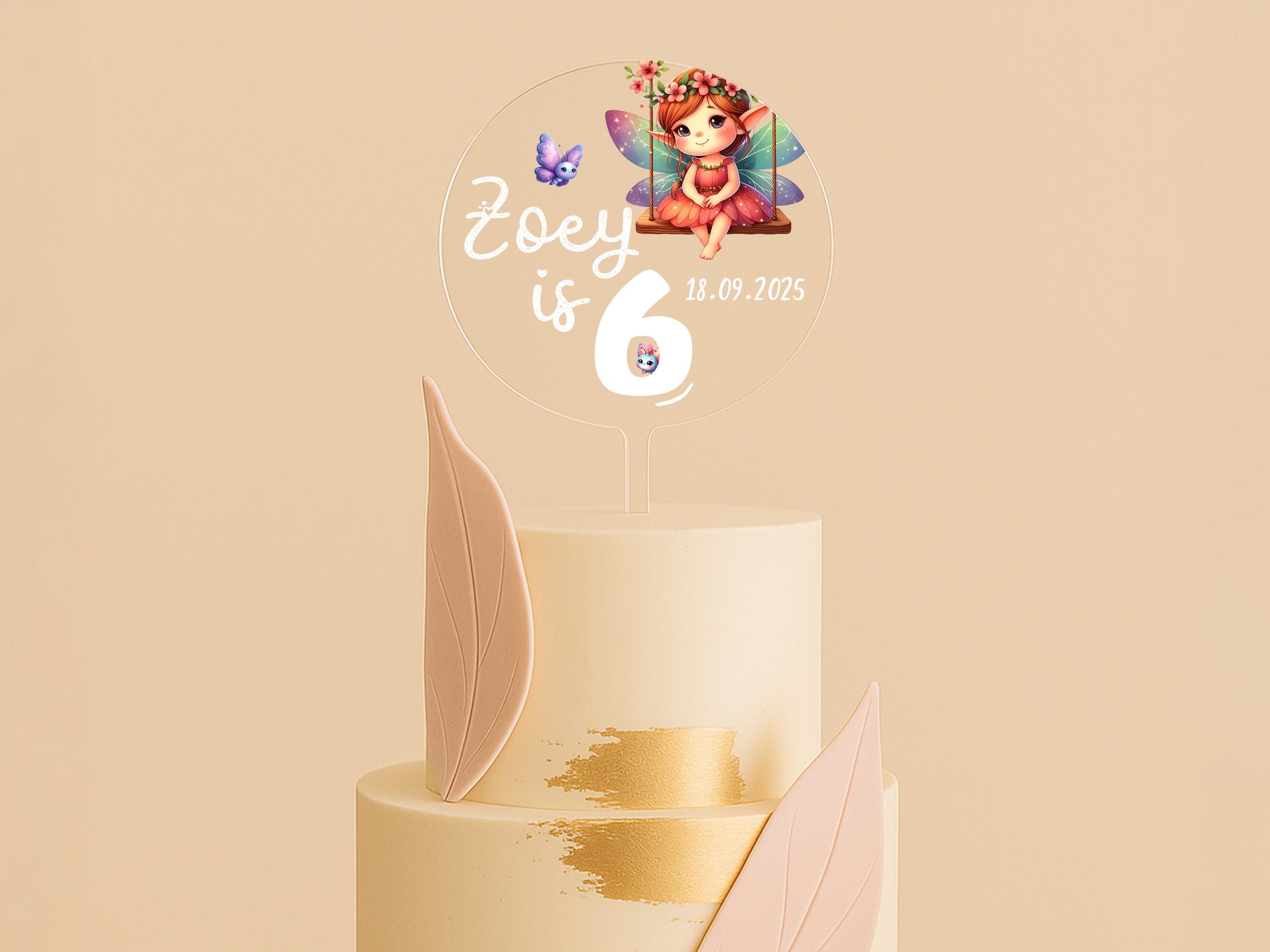 Custom clear acrylic cake topper with butterflies and fairy
