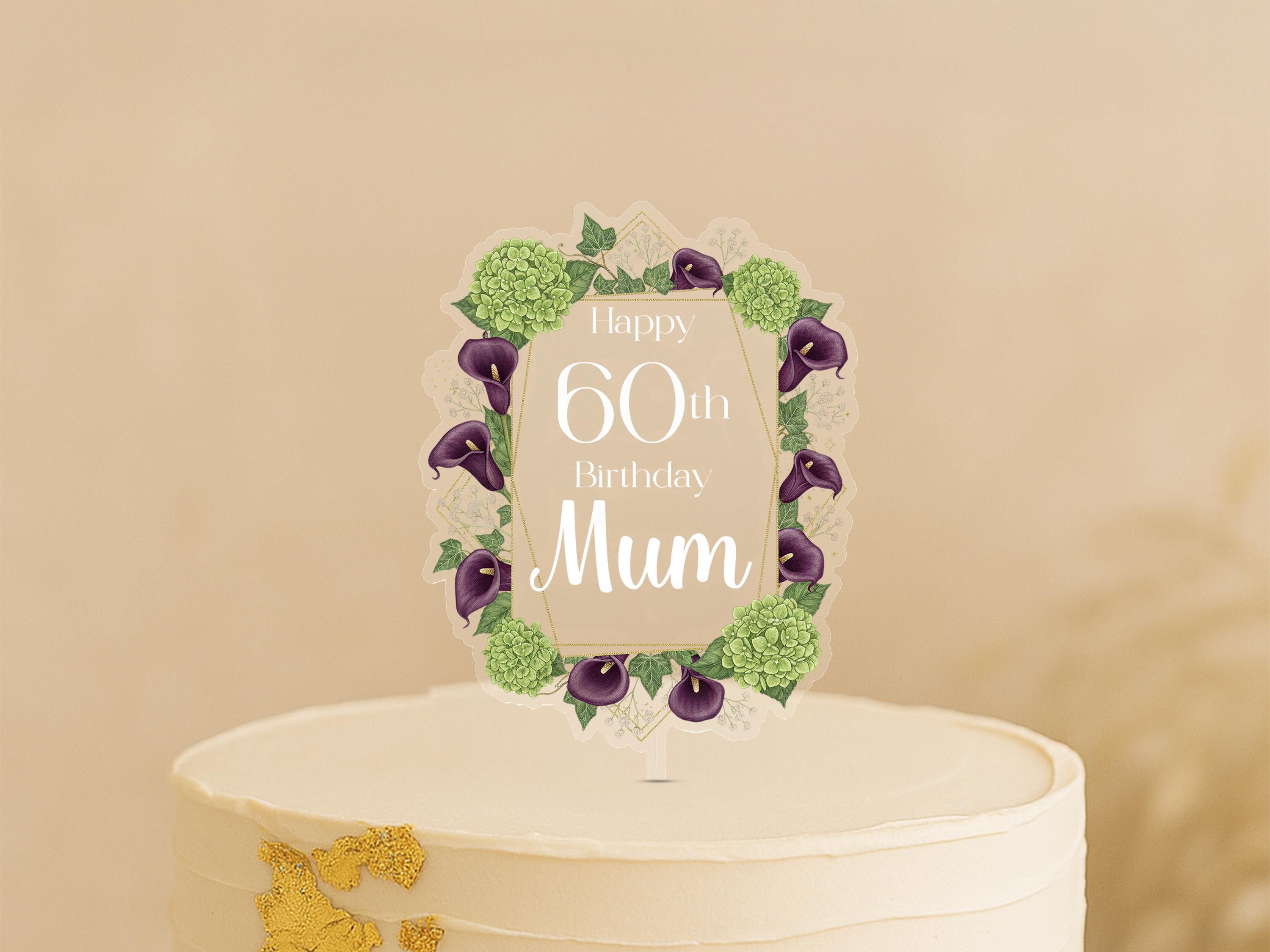 A white cake with a decorative frame and text on it, celebrating a 60th birthday.